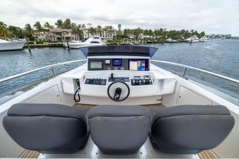 Slide: The Image of Cockpit view of 2018 Pershing 108 yacht with dual seats and navigation controls. - 32