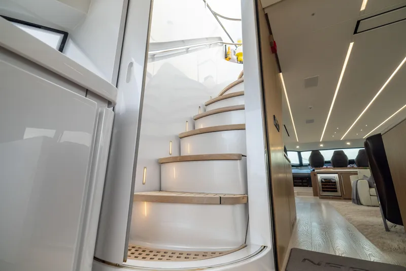 Slide: The Image of Luxurious interior of 2018 Pershing 108 yacht with elegant spiral staircase. - 33