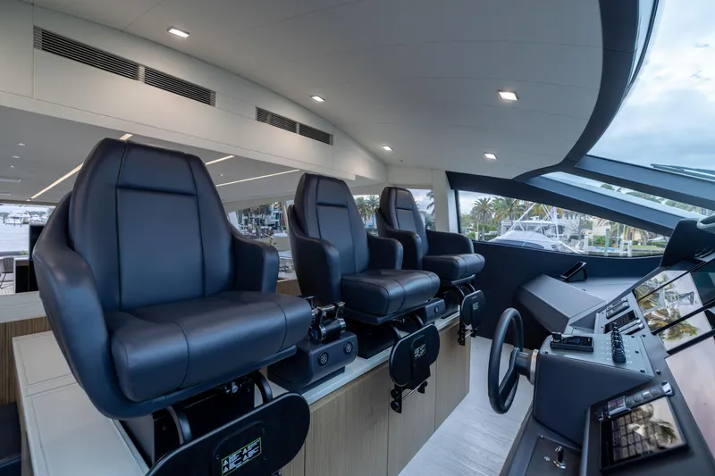 Slide: The Image of Luxurious interior of 2018 Pershing 108 yacht with modern helm seats and controls. - 45