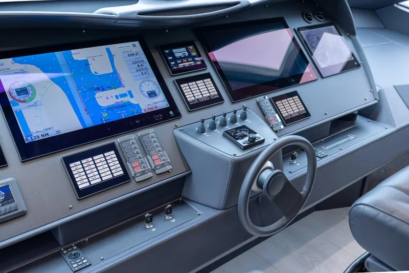 Slide: The Image of Control panel of a 2018 Pershing 108 yacht with advanced navigation displays. - 46