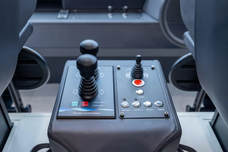 Slide: The Image of Control panel of a 2018 Pershing 108 yacht with joysticks and buttons. - 48