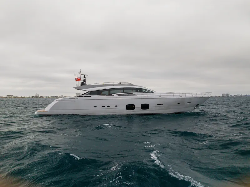 Slide: The Image of 2018 Pershing 108 yacht cruising on open water under cloudy skies. - 6