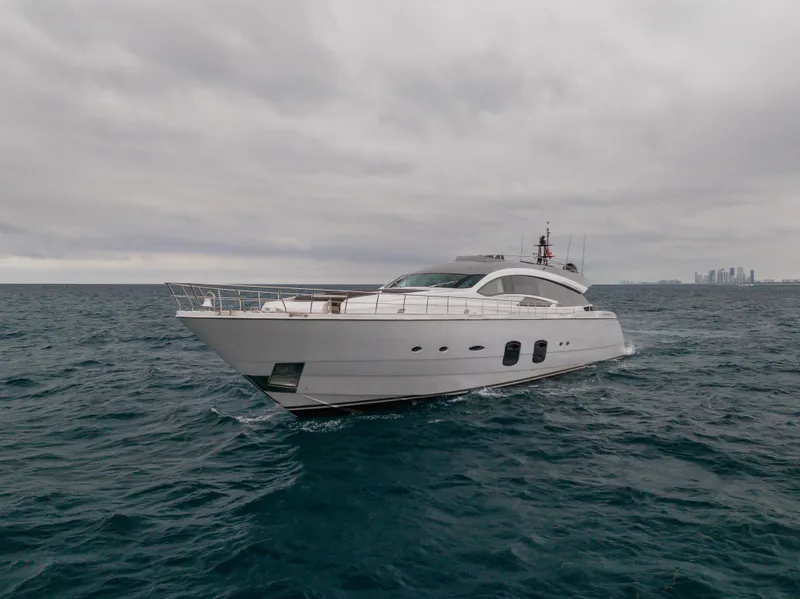 Slide: The Image of Luxury 2018 Pershing 108 yacht cruising on open sea under cloudy skies. - 9
