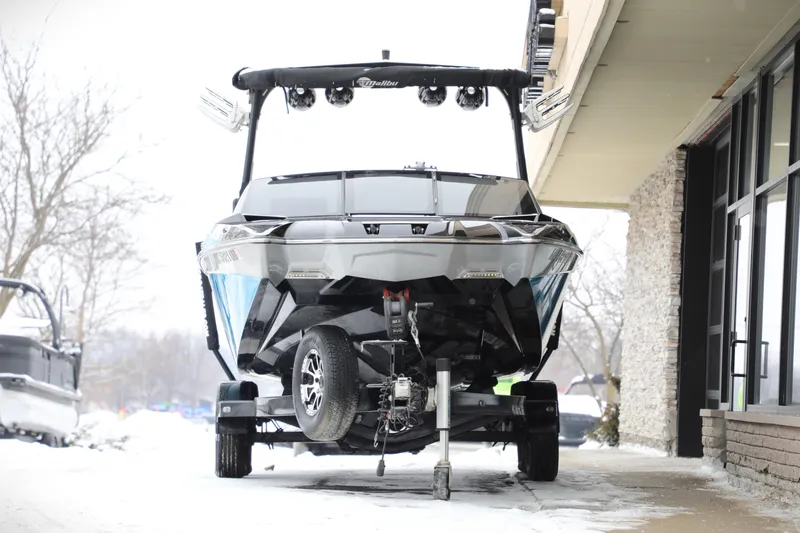 Slide: The Image of 2017 Malibu Wakesetter 22 MXZ boat on trailer in snowy setting. - 1