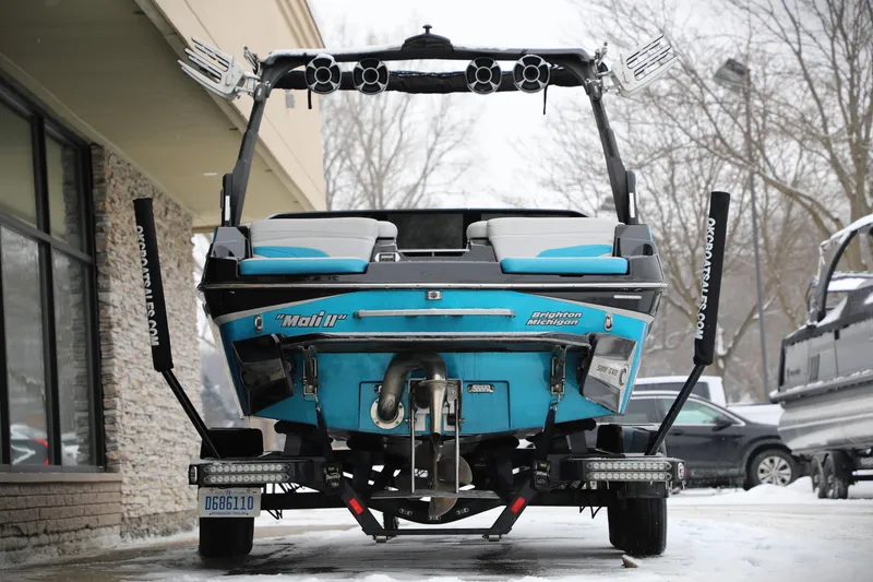 Slide: The Image of 2017 Malibu Wakesetter 22 MXZ boat on trailer, rear view in snowy setting. - 13