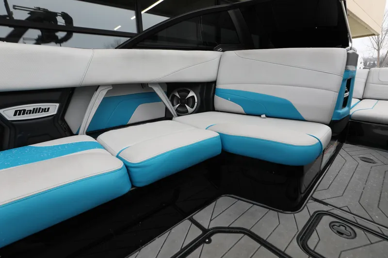 Slide: The Image of 2017 Malibu Wakesetter 22 MXZ interior with blue and white seating. - 6