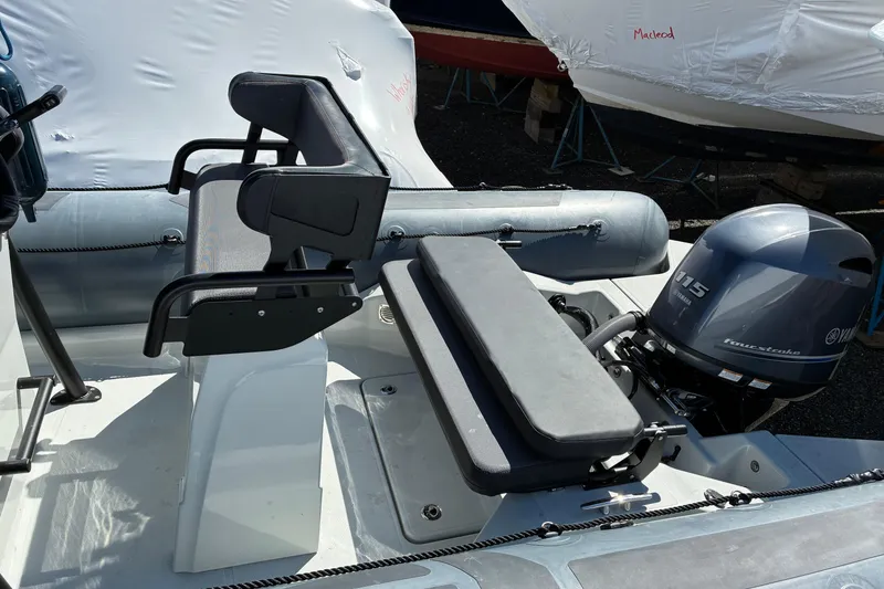 Slide: The Image of 2024 Zodiac Pro 5.5 inflatable boat with T-top and outboard motor. - 3