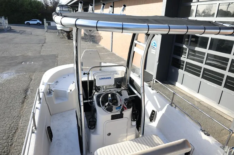 Slide: The Image of 2013 Carolina Skiff 178 DLV boat with steering console and Lowrance navigation system. - 17