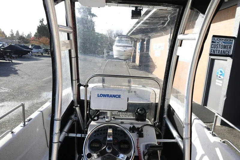 Slide: The Image of 2013 Carolina Skiff 178 DLV boat interior with Lowrance navigation system. - 20