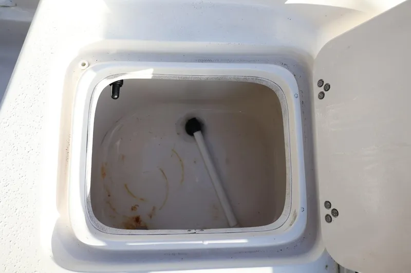 Slide: The Image of Open storage compartment on a 2013 Carolina Skiff 178 DLV boat. - 39