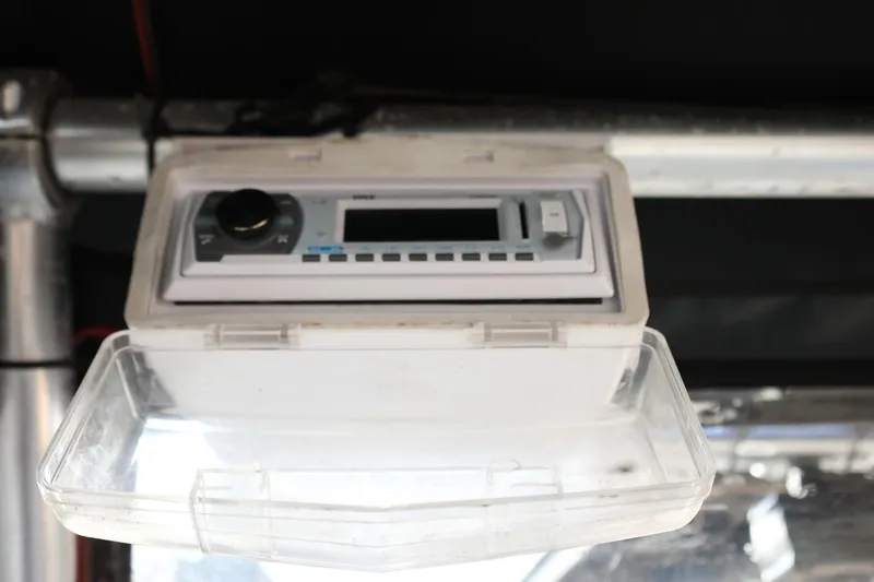 Slide: The Image of 2013 Carolina Skiff 178 DLV boat stereo system with protective cover. - 43