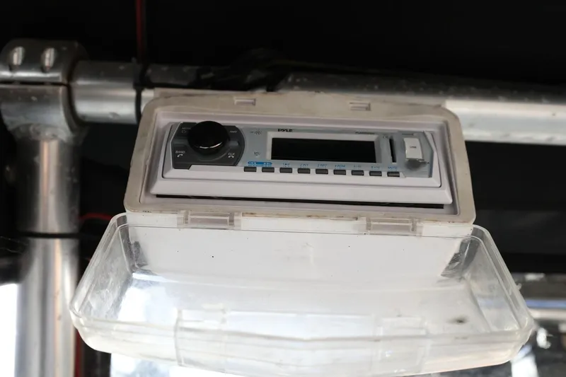 Slide: The Image of 2013 Carolina Skiff 178 DLV boat stereo system with protective cover. - 44