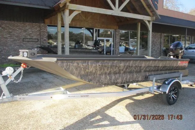 Slide: The Image of 2026 Reaper Boats 753-1879 model on trailer outside a building. - 4