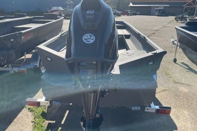 Slide: The Image of 2026 Reaper Boats 753-1879 model with 60 HP engine, parked outdoors. - 8