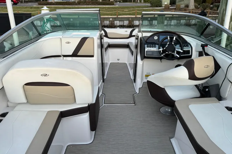 Slide: The Image of 2016 Regal 23 OBX boat interior with modern seating and steering wheel. - 11