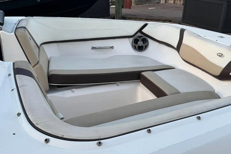 Slide: The Image of 2016 Regal 23 OBX boat interior with beige and white seating. - 17