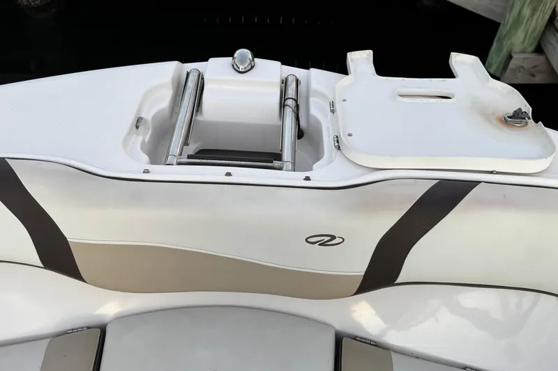 Slide: The Image of 2016 Regal 23 OBX boat stern with swim ladder and storage compartment. - 18