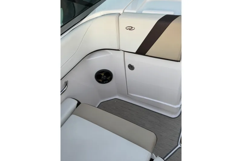 Slide: The Image of 2016 Regal 23 OBX boat interior with beige and white seating. - 22