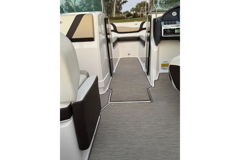 Slide: The Image of 2016 Regal 23 OBX boat interior with sleek seating and modern dashboard. - 28
