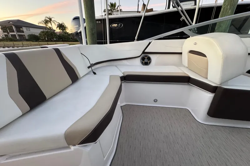 Slide: The Image of Interior seating of 2016 Regal 23 OBX boat with beige and brown upholstery. - 29