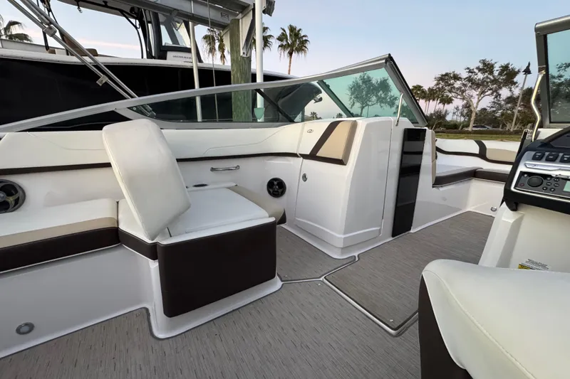 Slide: The Image of 2016 Regal 23 OBX boat interior with seating and dashboard, featuring modern design elements. - 30