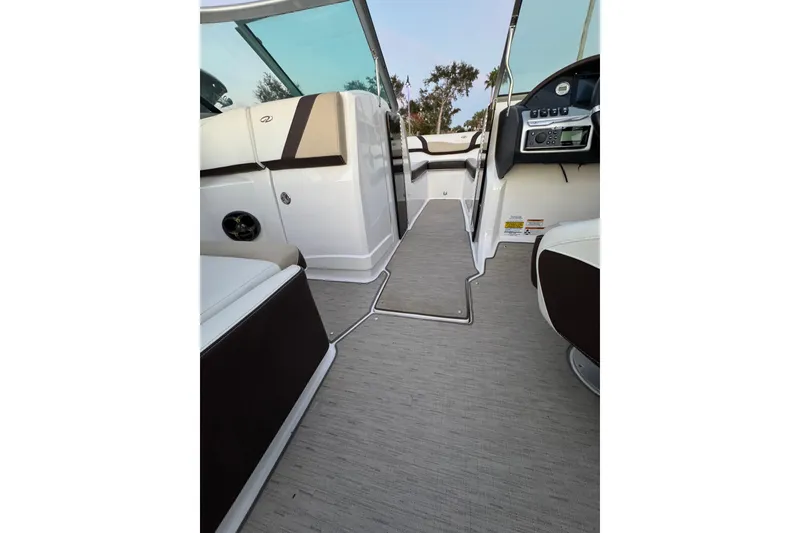 Slide: The Image of Interior view of 2016 Regal 23 OBX boat, featuring sleek design and modern controls. - 31