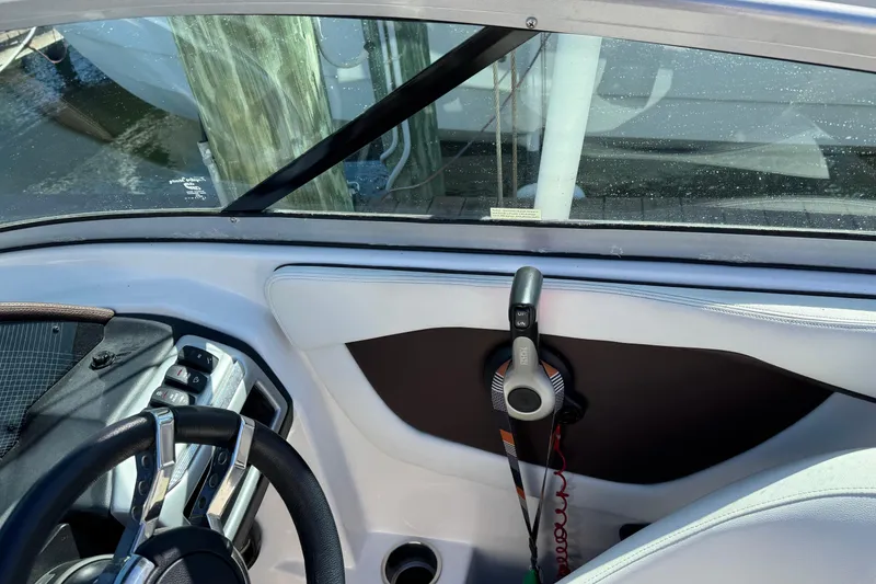 Slide: The Image of 2016 Regal 23 OBX boat docked at sunset with Florida registration. - 4