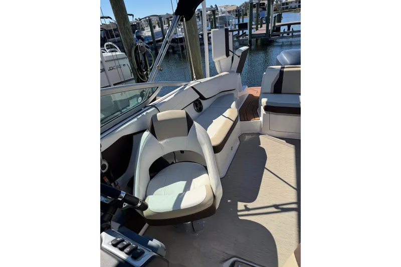 Slide: The Image of 2016 Regal 23 OBX boat with Florida registration, docked on a lift. - 5