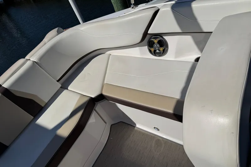 Slide: The Image of 2016 Regal 23 OBX boat interior with steering wheel and seating area. - 8