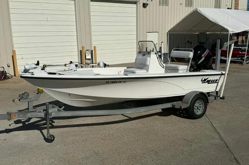 The Image of 2007 Mako 1801 Inshore boat on trailer, parked outdoors near a building. - 0