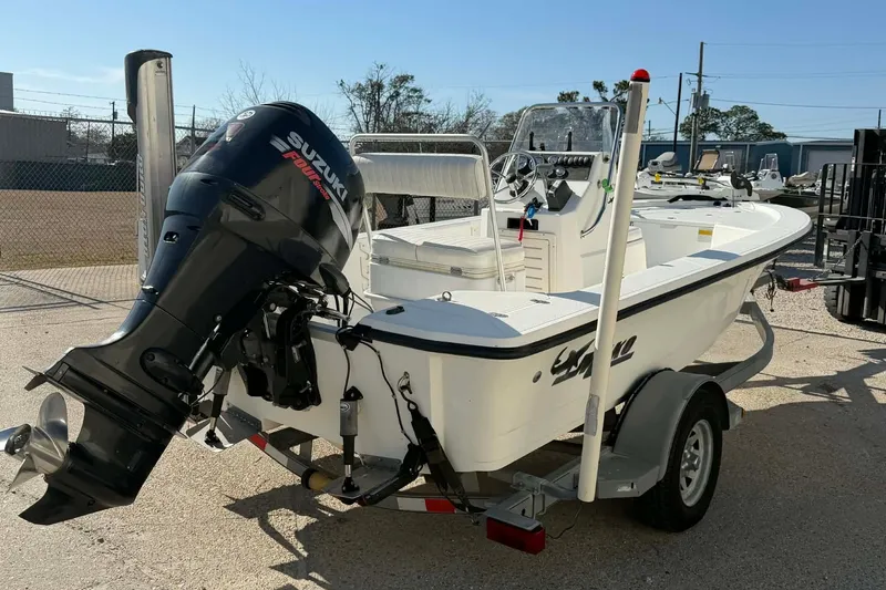 Slide: The Image of 2007 Mako 1801 Inshore boat with Suzuki outboard motor on trailer. - 9
