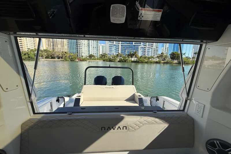 Slide: The Image of Interior view of 2026 Navan C30 boat overlooking waterfront cityscape. - 19