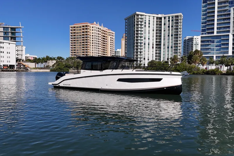 Slide: The Image of Navan C30 2026 boat on water, urban skyline background, sunny day. - 3