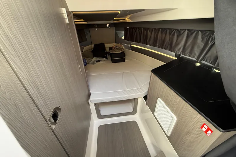 Slide: The Image of Interior of 2026 Navan C30 cabin with bed and modern wood finish. - 31