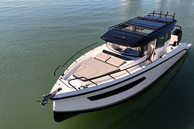 Slide: The Image of Navan C30 2026 boat on calm water, featuring sleek design and modern amenities. - 6