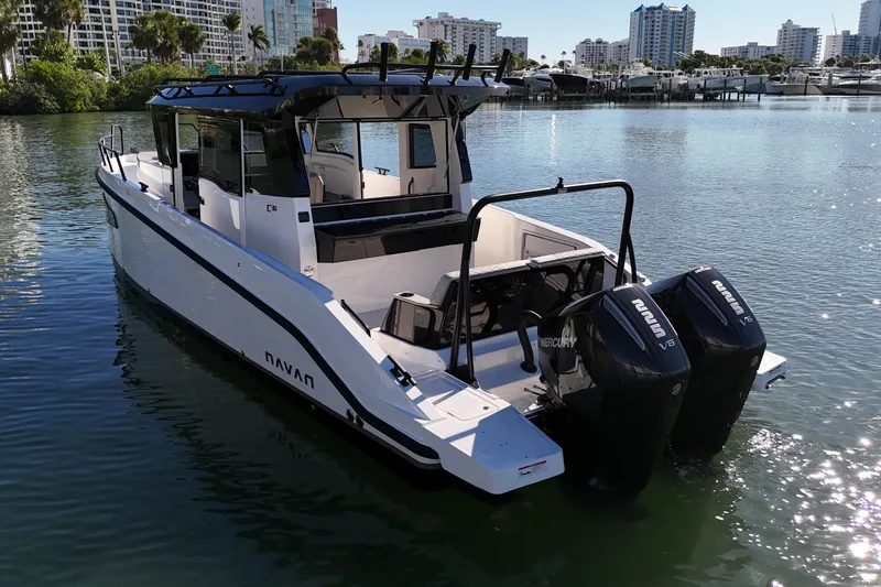 Slide: The Image of 2026 Navan C30 boat with dual Mercury engines on calm water. - 9