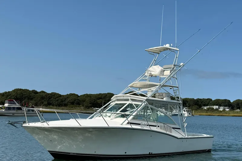 Slide: The Image of 2007 Carolina Classic 35 Express boat on calm water with clear blue sky. - 1
