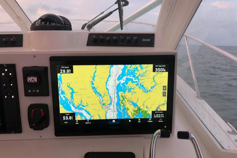 Slide: The Image of Navigation system on 2007 Carolina Classic 35 Express boat, displaying GPS and map data. - 10