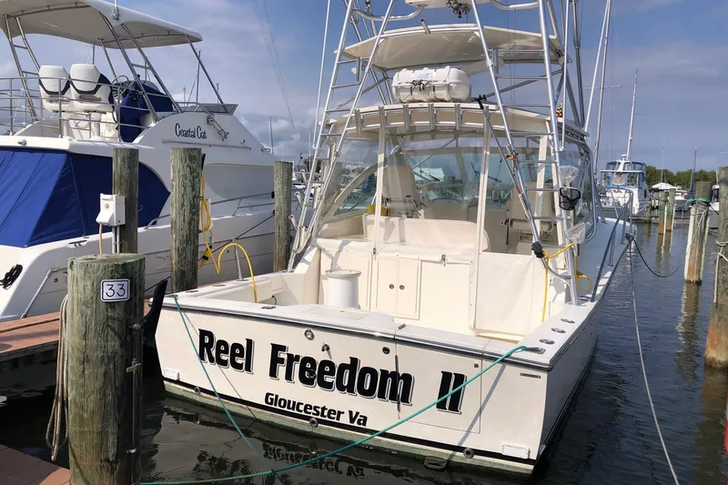 Slide: The Image of 2007 Carolina Classic 35 Express boat docked, named "Reel Freedom II," in Gloucester, Virginia. - 2