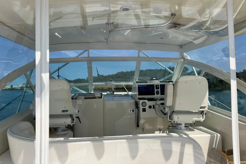 Slide: The Image of 2007 Carolina Classic 35 Express boat interior with helm and seating. - 5