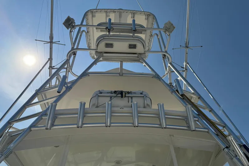 Slide: The Image of 2007 Carolina Classic 35 Express boat tower under clear blue sky. - 6