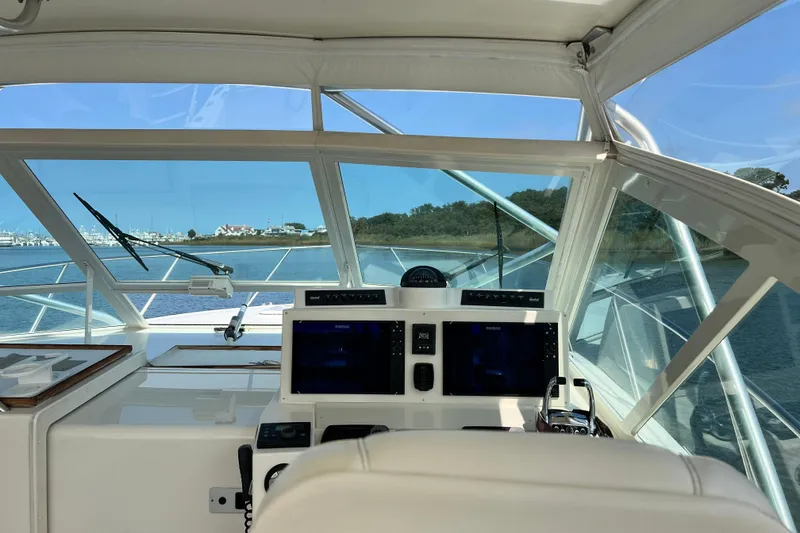 Slide: The Image of Interior view of 2007 Carolina Classic 35 Express boat cockpit with navigation equipment. - 8