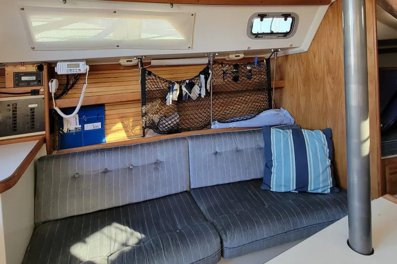 Slide: The Image of Interior of 1993 Catalina 28 sailboat with cozy seating and nautical decor. - 22