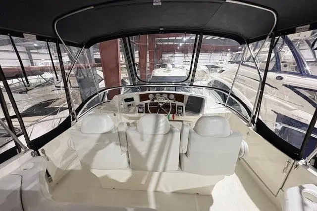 Slide: The Image of 2003 Silverton 39 Motor Yacht bathroom with shower, sink, and toilet. - 15