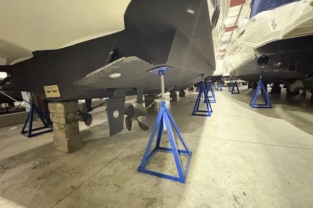 Slide: The Image of Luxurious bedroom interior of 2003 Silverton 39 Motor Yacht with elegant bedding and wood finish. - 17