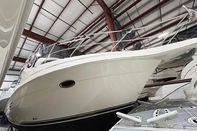 Slide: The Image of Interior of 2003 Silverton 39 Motor Yacht bedroom with wood paneling and TV. - 18