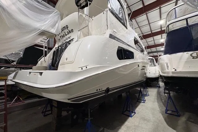Slide: The Image of 2003 Silverton 39 Motor Yacht bathroom with wood cabinetry and modern fixtures. - 19