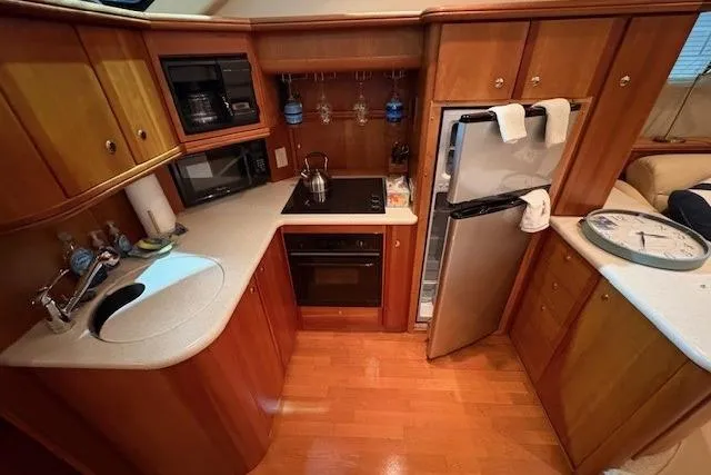 Slide: The Image of Engine room of 2003 Silverton 39 Motor Yacht with visible wiring and equipment. - 28