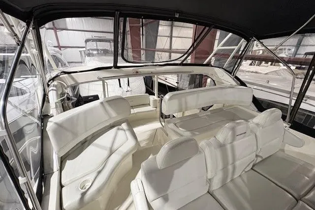 Slide: The Image of 2003 Silverton 39 Motor Yacht interior with white seating and spacious layout. - 7
