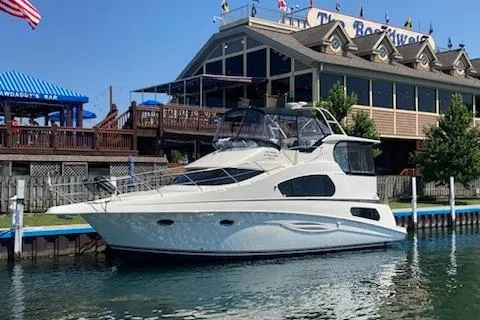 Slide: The Image of Interior of 2003 Silverton 39 Motor Yacht with cozy seating and entertainment area. - 9